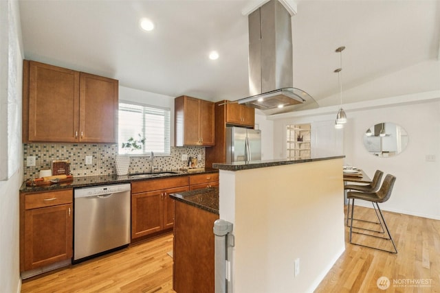 13503 Densmore Ave N, Seattle, WA 98133 - kitchen with appliances with stainless steel finishes, a sink, island range hood, a center island, and light wood-style floors