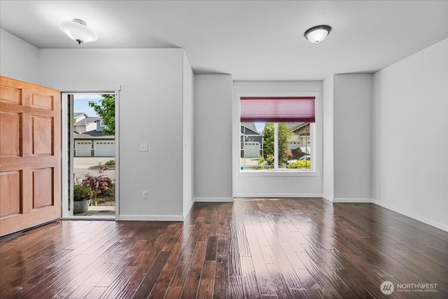 entryway featuring dark wood-style floors and baseboards