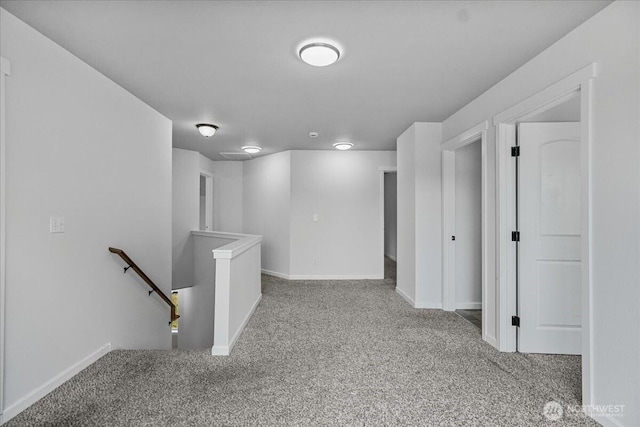 basement featuring carpet and baseboards