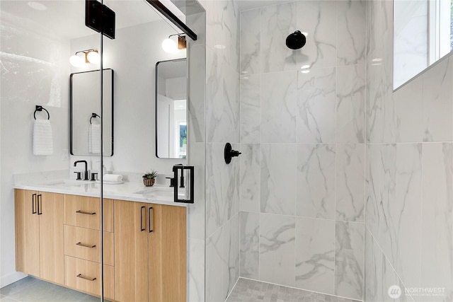 627A W Emerson St, Seattle, WA 98119 - bathroom featuring double vanity, tiled shower, and a sink