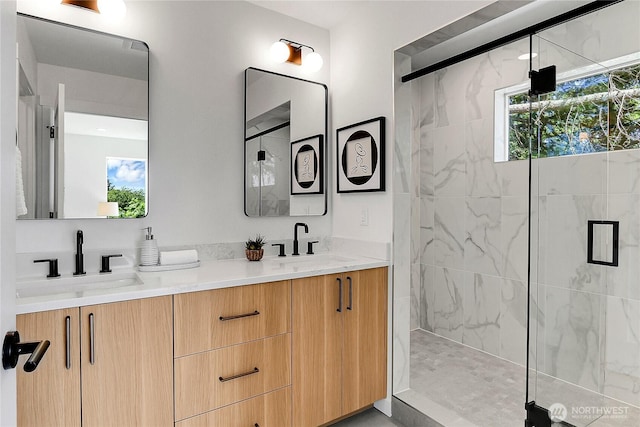 627A W Emerson St, Seattle, WA 98119 - full bath with a sink, double vanity, and tiled shower