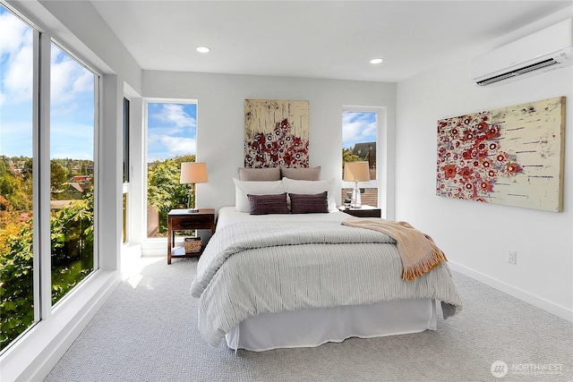627A W Emerson St, Seattle, WA 98119 - bedroom with an AC wall unit, carpet flooring, baseboards, and recessed lighting