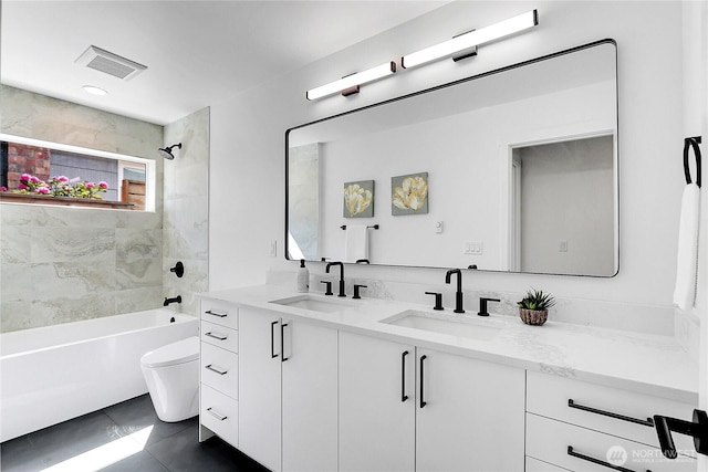 627A W Emerson St, Seattle, WA 98119 - full bathroom featuring double vanity, a sink, shower / bathing tub combination, and toilet