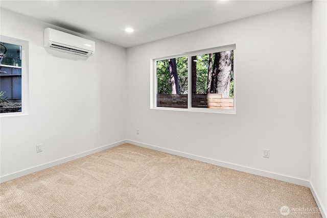 627A W Emerson St, Seattle, WA 98119 - carpeted spare room featuring recessed lighting, baseboards, and a wall unit AC