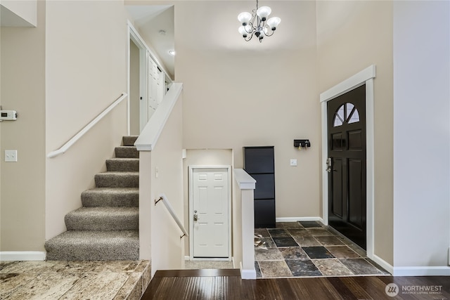 22606 NE 14th Dr, Sammamish, WA 98074 - entryway featuring stone finish floor, baseboards, a chandelier, a high ceiling, and stairs