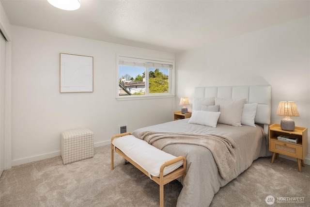1751 NW 58th St Unit 4, Seattle, WA 98107 - bedroom featuring baseboards, visible vents, and light colored carpet