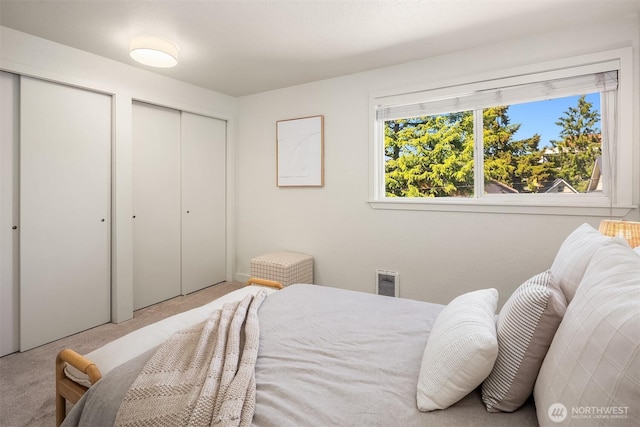 1751 NW 58th St Unit 4, Seattle, WA 98107 - carpeted bedroom with multiple closets