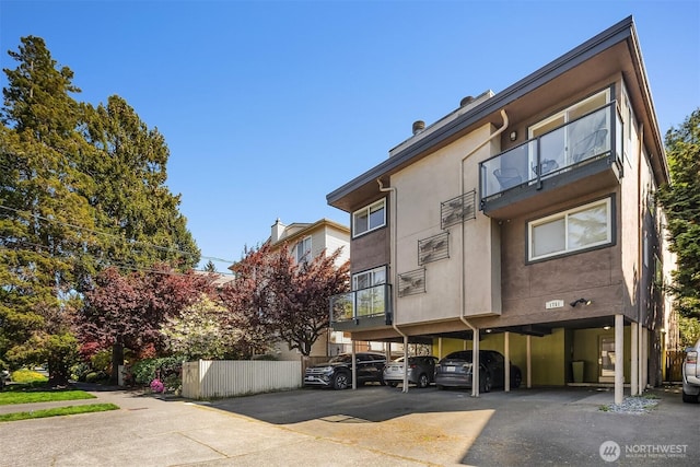 1751 NW 58th St Unit 4, Seattle, WA 98107 - view of property featuring covered parking