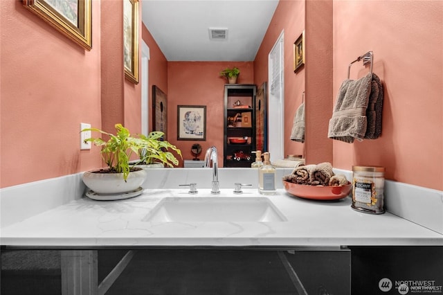 bathroom featuring visible vents and vanity