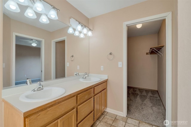 4141 Ingleside Loop SE, Lacey, WA 98503 - bathroom with a ceiling fan, baseboards, double vanity, and a sink