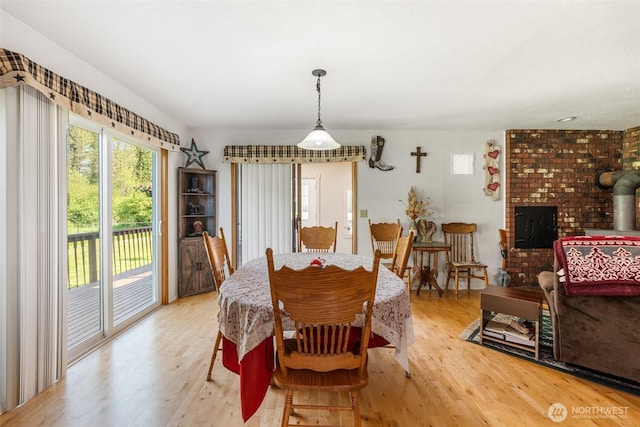 584 Gish Rd, Onalaska, WA 98570 - dining room with a wood stove and light wood-type flooring