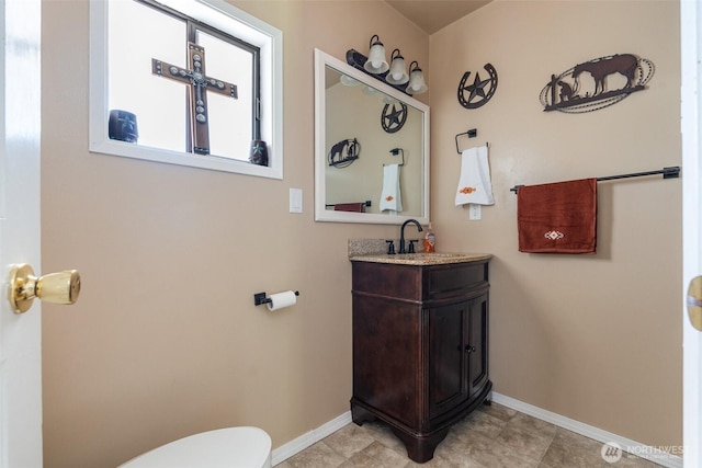 584 Gish Rd, Onalaska, WA 98570 - half bathroom with toilet, baseboards, and vanity