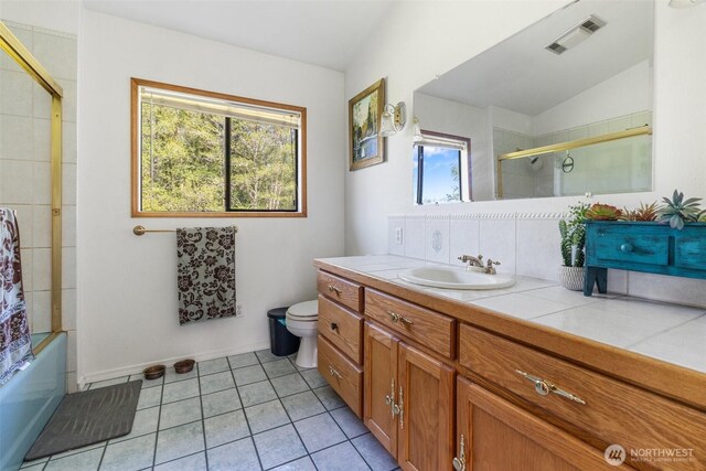 584 Gish Rd, Onalaska, WA 98570 - full bath featuring visible vents, vanity, tile patterned floors, toilet, and enclosed tub / shower combo