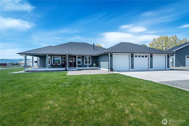 view of front of home featuring a front yard, an attached garage, driveway, and roof with shingles