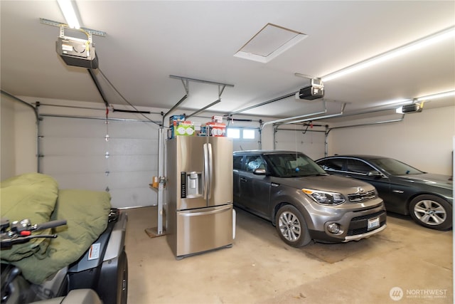 garage with a garage door opener and stainless steel fridge with ice dispenser