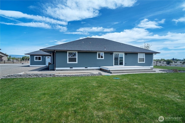 back of property with a lawn