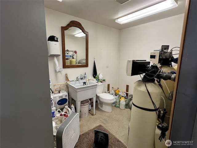 bathroom featuring toilet