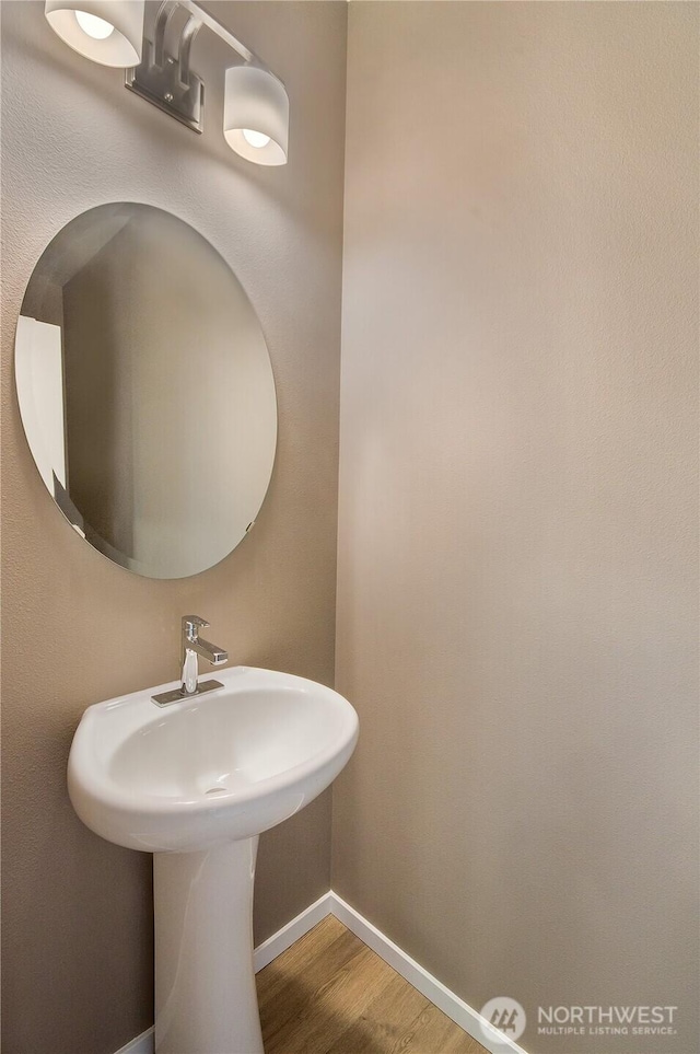 18214 37th Ave E, Tacoma, WA 98446 - bathroom with baseboards and wood finished floors