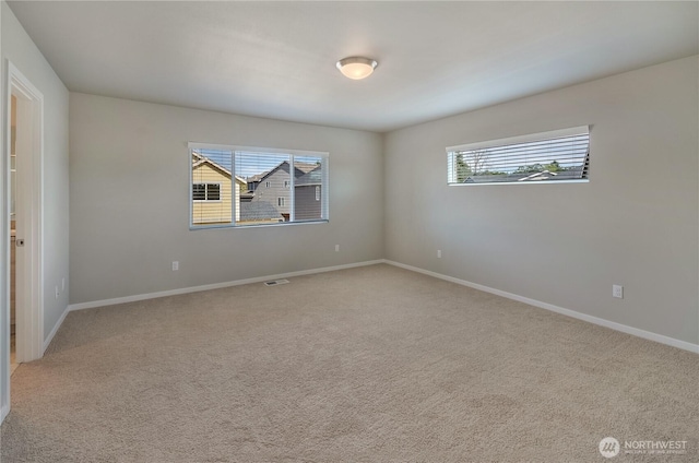 18214 37th Ave E, Tacoma, WA 98446 - empty room with baseboards, visible vents, and light colored carpet
