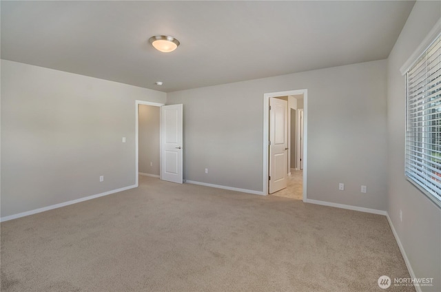 18214 37th Ave E, Tacoma, WA 98446 - unfurnished bedroom with baseboards and light colored carpet
