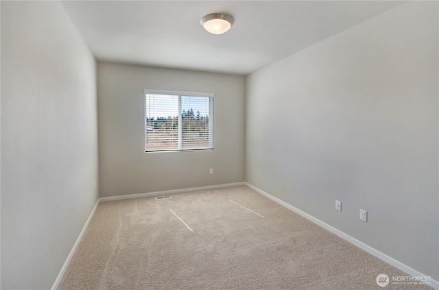 18214 37th Ave E, Tacoma, WA 98446 - carpeted spare room with baseboards and visible vents