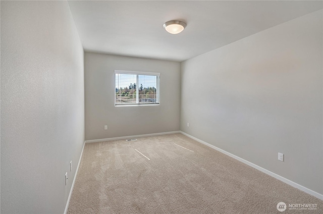 18214 37th Ave E, Tacoma, WA 98446 - unfurnished room featuring carpet floors, baseboards, and visible vents