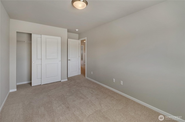 18214 37th Ave E, Tacoma, WA 98446 - unfurnished bedroom with carpet floors, baseboards, and a closet