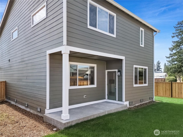 18214 37th Ave E, Tacoma, WA 98446 - back of house with fence, a lawn, a patio area, and crawl space