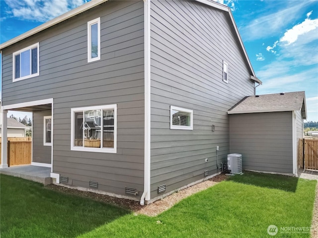 18214 37th Ave E, Tacoma, WA 98446 - rear view of property featuring a yard, crawl space, central AC, and fence
