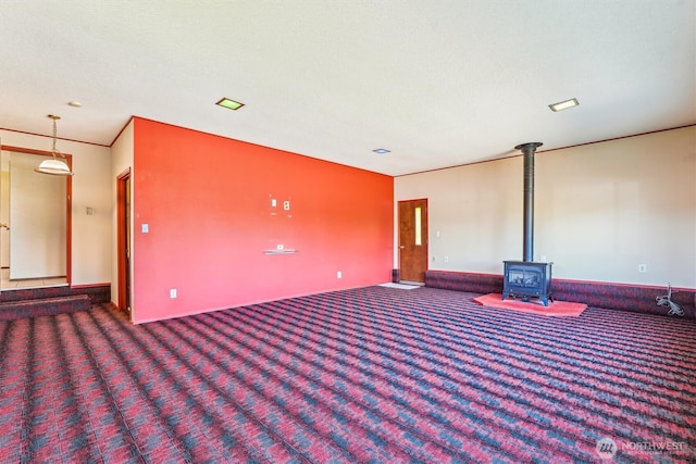 1015 14th St NW, Puyallup, WA 98371 - carpeted spare room with a wood stove