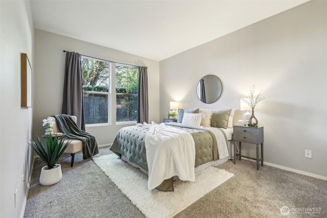 bedroom with carpet floors and baseboards