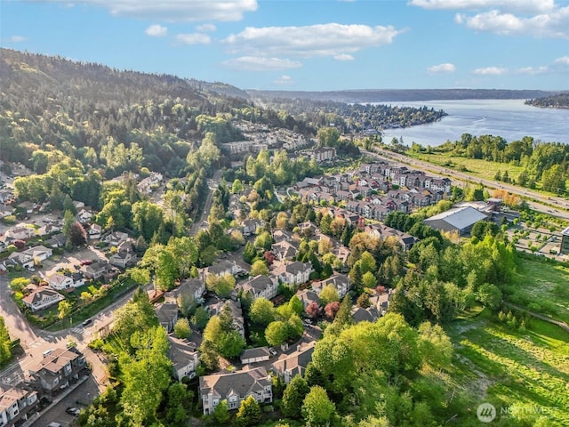 bird's eye view with a water view and a residential view