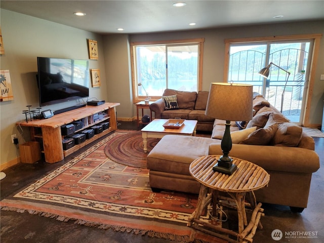 living area with recessed lighting, baseboards, and plenty of natural light