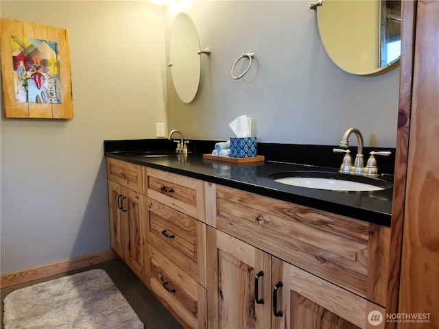 bathroom with a sink and double vanity