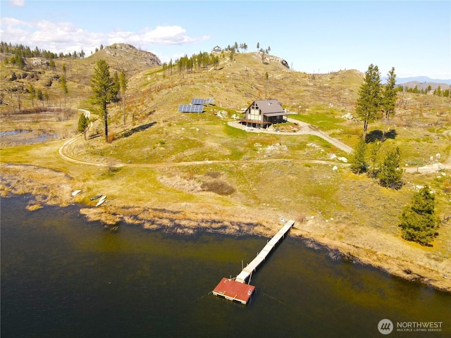 aerial view featuring a water and mountain view