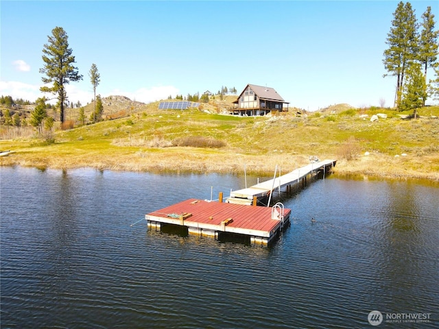 dock area featuring a water view