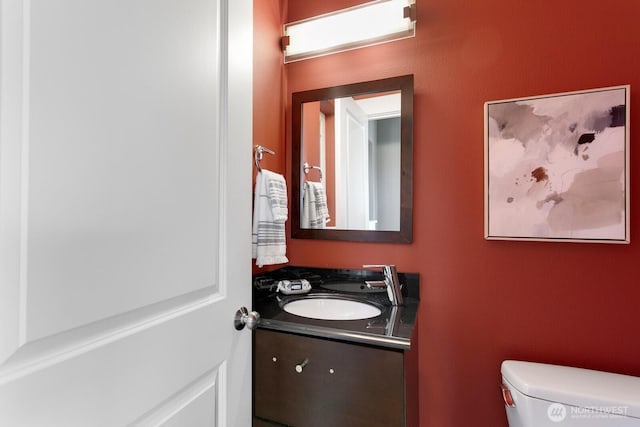 bathroom with toilet and vanity