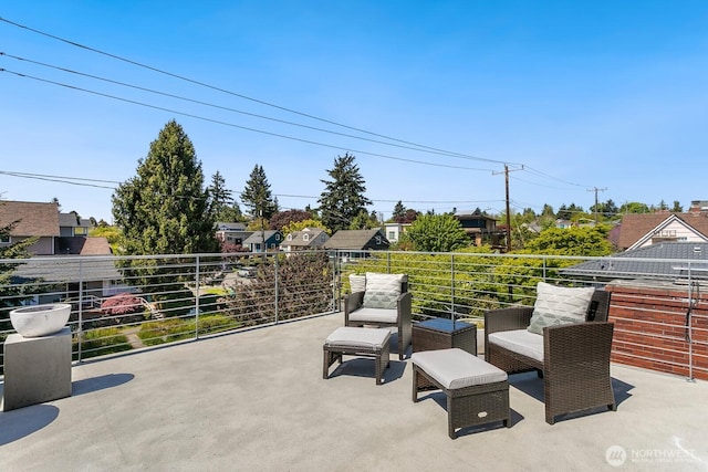 view of patio / terrace with a residential view and a balcony