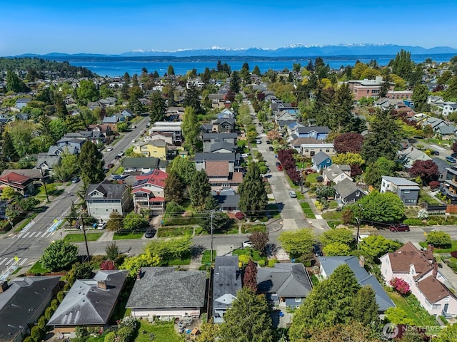 bird's eye view featuring a residential view and a water and mountain view