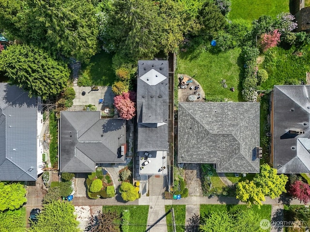 birds eye view of property with a residential view