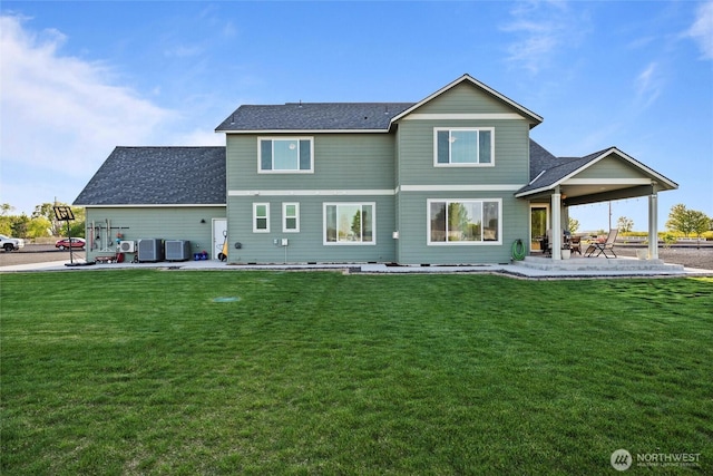 back of property featuring a patio area, central air condition unit, a yard, and roof with shingles