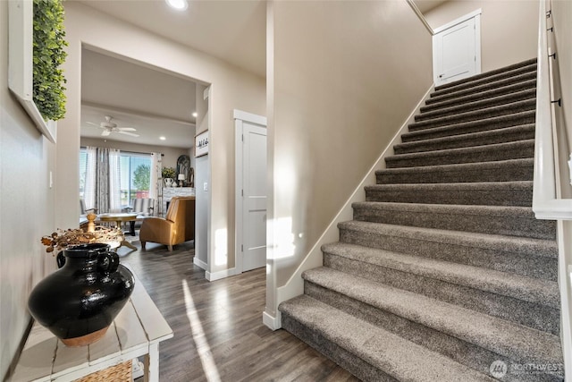 stairway with recessed lighting, baseboards, ceiling fan, and wood finished floors