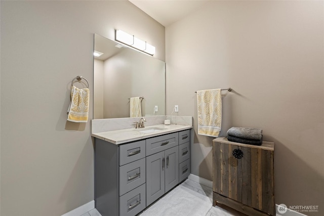 bathroom with baseboards and vanity