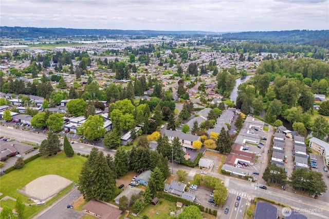 aerial view of property's location with nearby suburban area