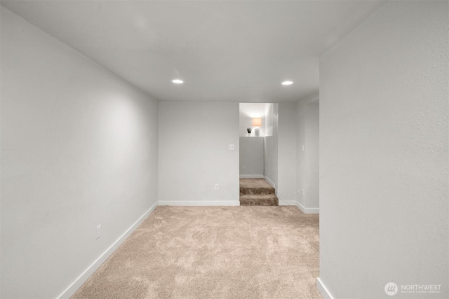 carpeted empty room featuring recessed lighting and baseboards