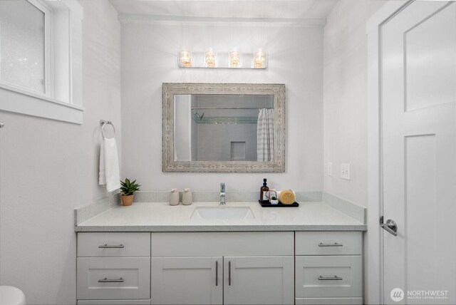 bathroom with vanity and curtained shower