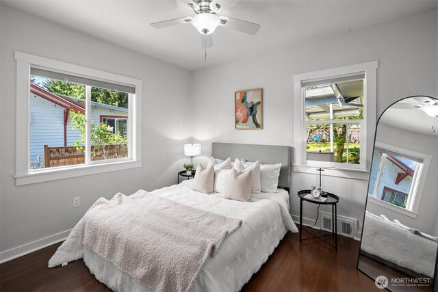 bedroom with wood finished floors, baseboards, and a ceiling fan