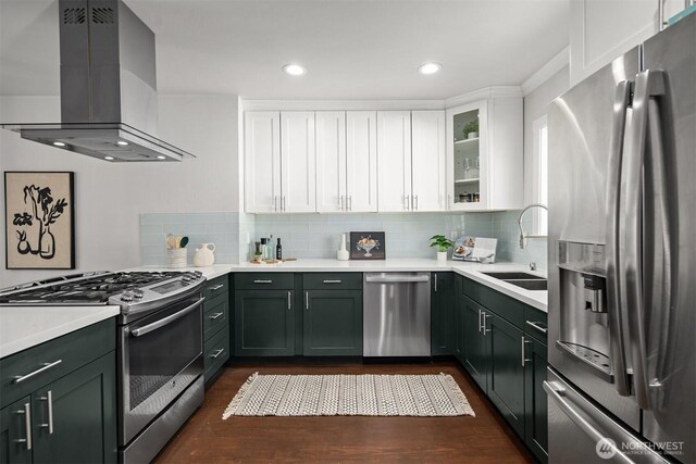 kitchen featuring stainless steel appliances, island exhaust hood, dark wood finished floors, white cabinetry, and recessed lighting