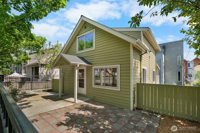6638 Corson Ave S, Seattle, WA 98108 - back of property featuring a patio and fence
