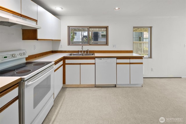 6638 Corson Ave S, Seattle, WA 98108 - kitchen with a healthy amount of sunlight, white appliances, white cabinetry, under cabinet range hood, and a sink